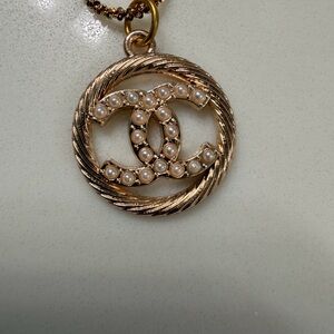 Zipper pull charm on unbranded chain